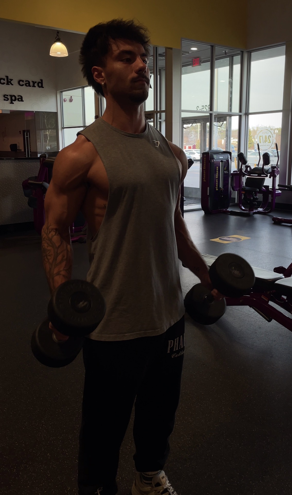 After transformation — lean and muscular in gym