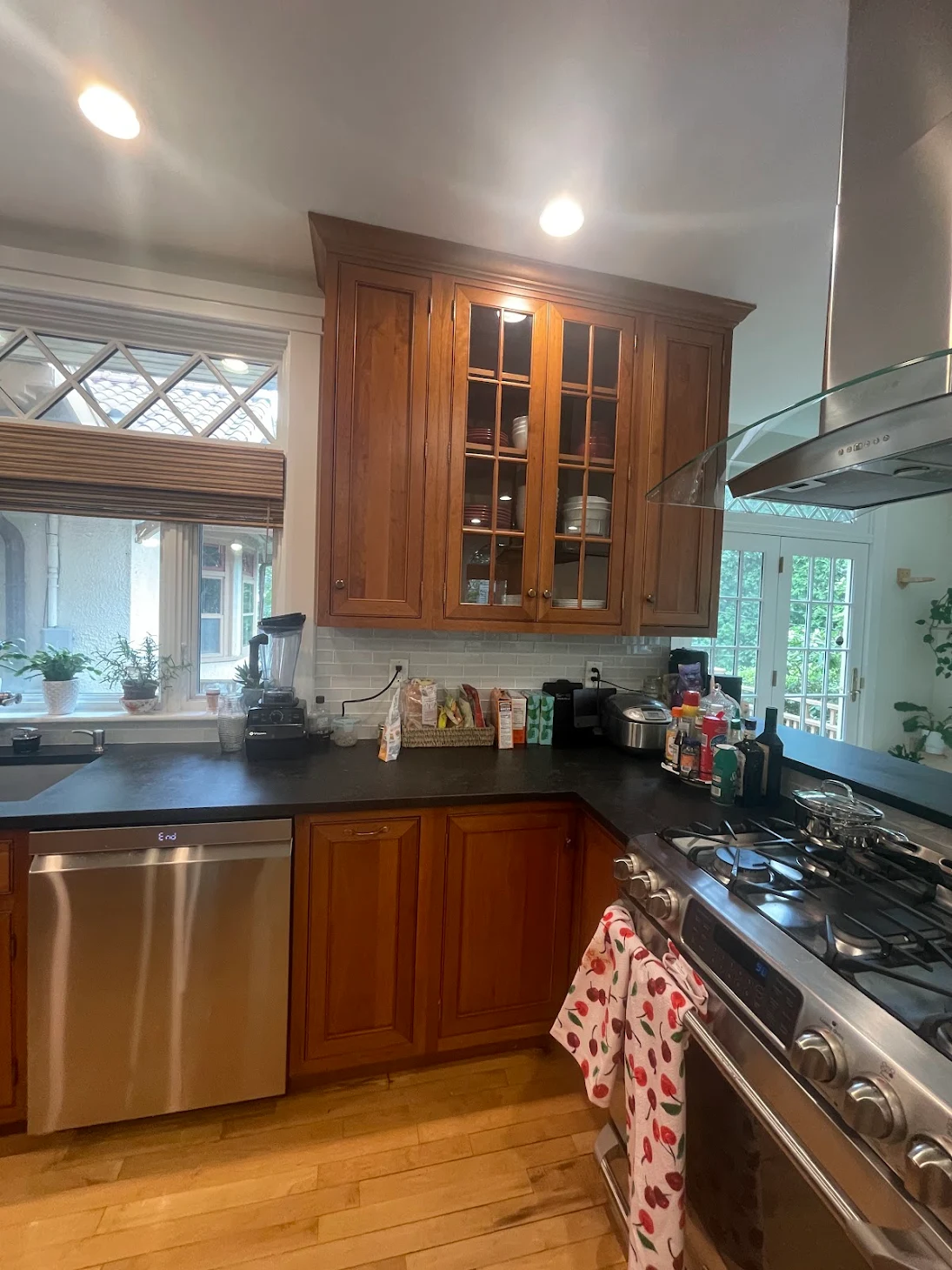 Oak kitchen cabinets near stove before painting