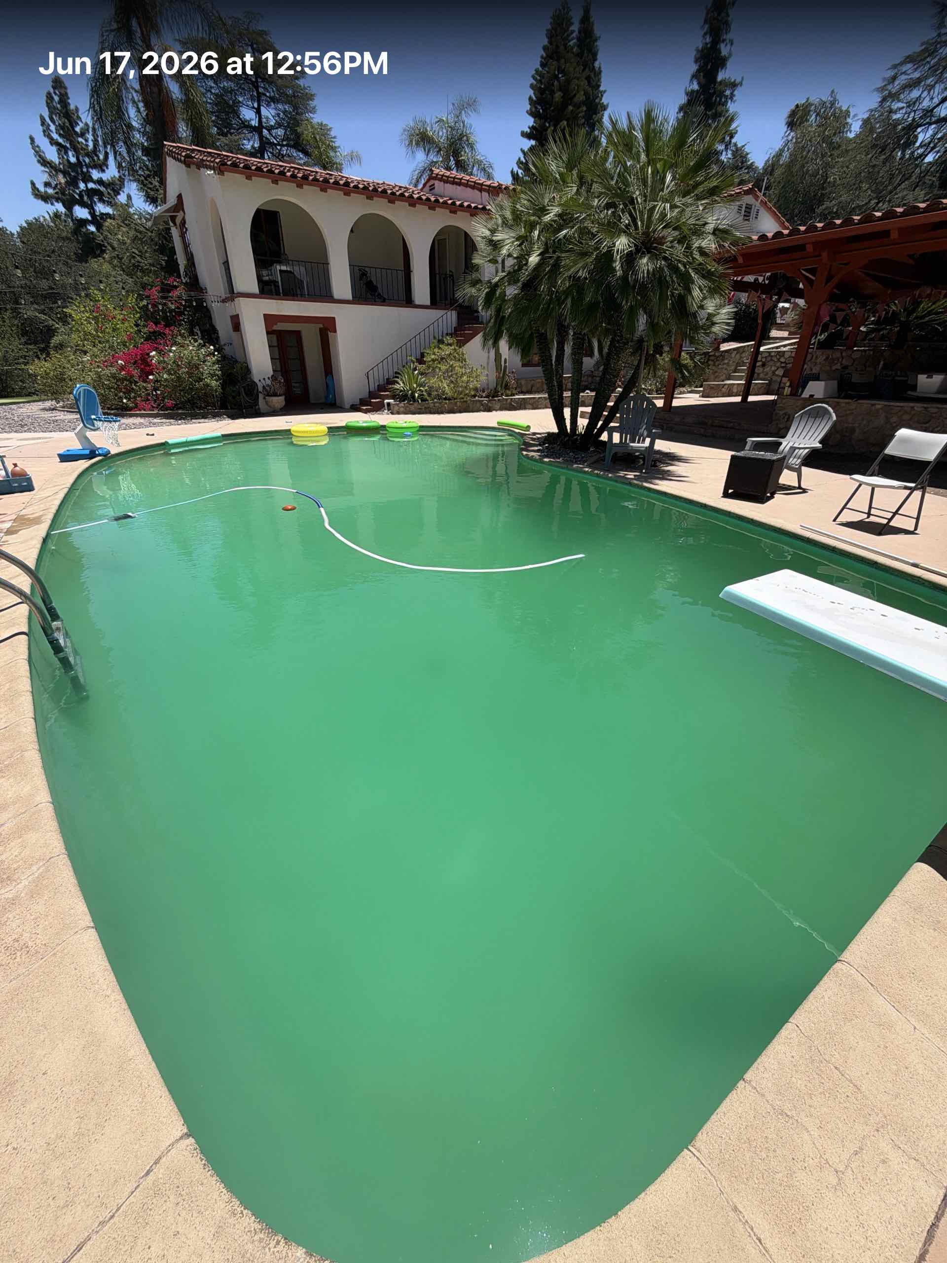 Green pool before algae recovery treatment in Redlands CA