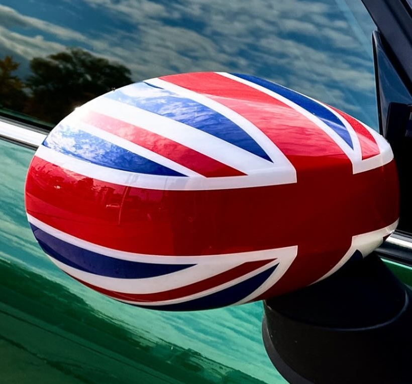 Union Jack car mirror reflecting the sky