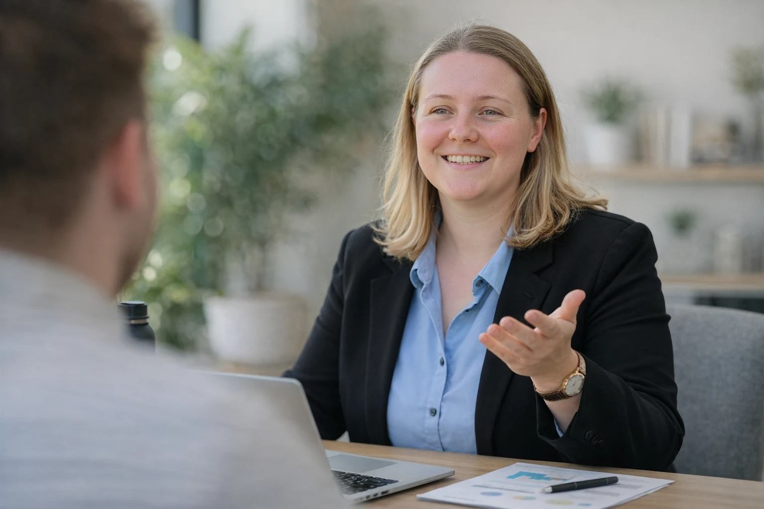 Sara Rowe discussing property plans with clients
