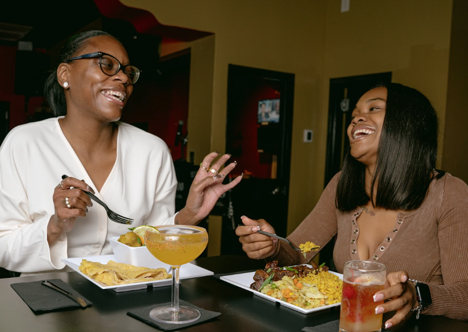 Guests enjoying food, drinks and celebration at Marquis