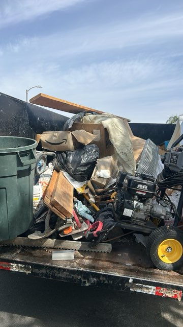 Full truckload of mixed junk and appliances hauled away