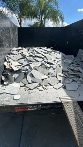 Dump trailer filled with broken concrete and tiles