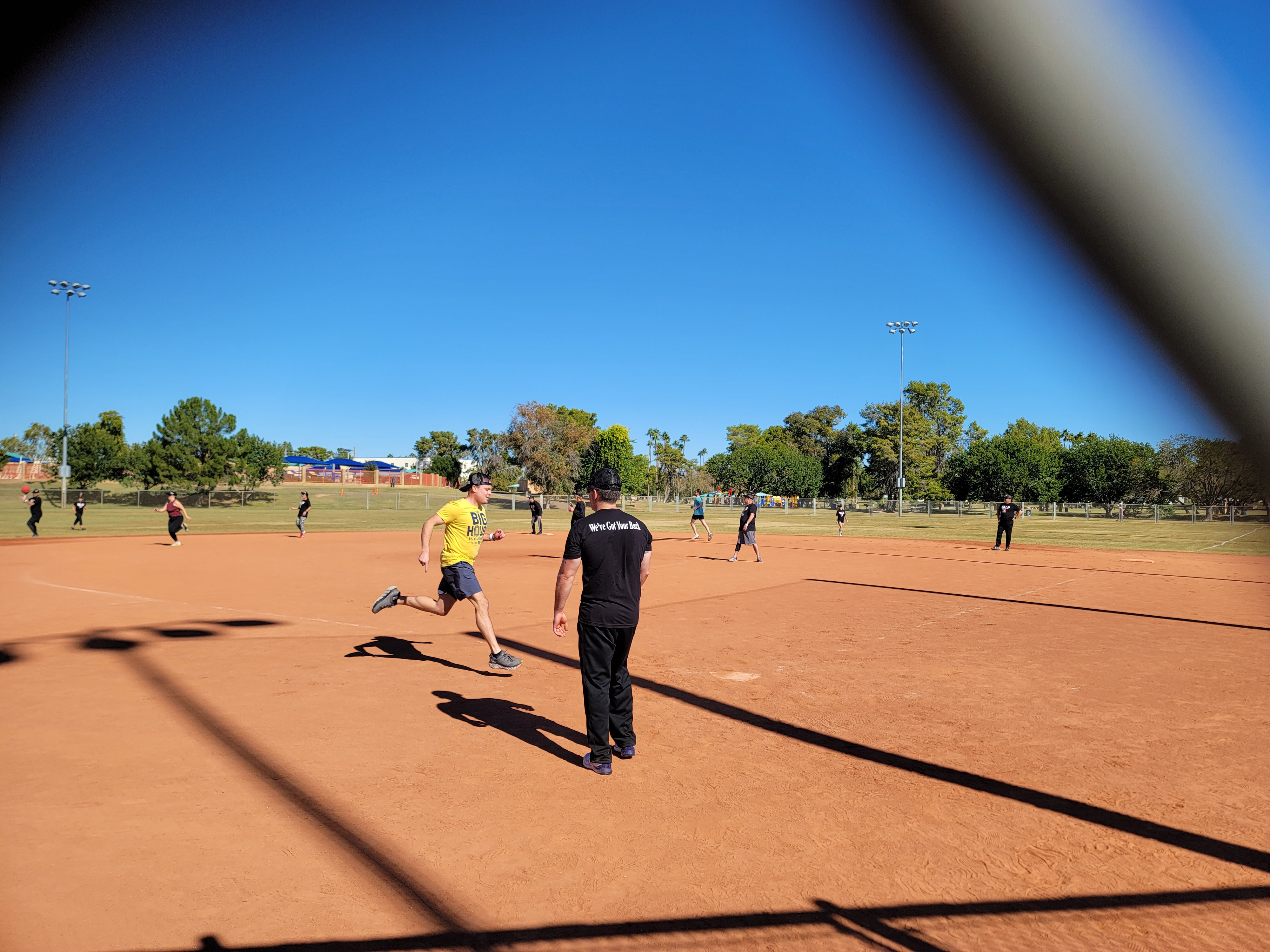Player running bases during the Stars & Strikes kickball game