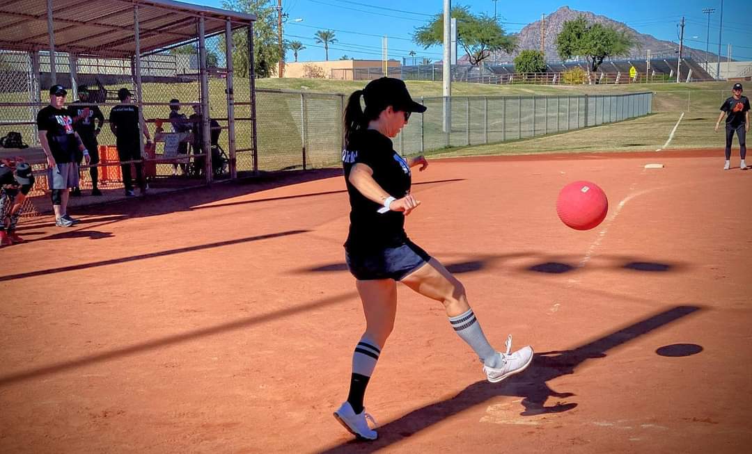 Player kicking a red kickball during tournament action