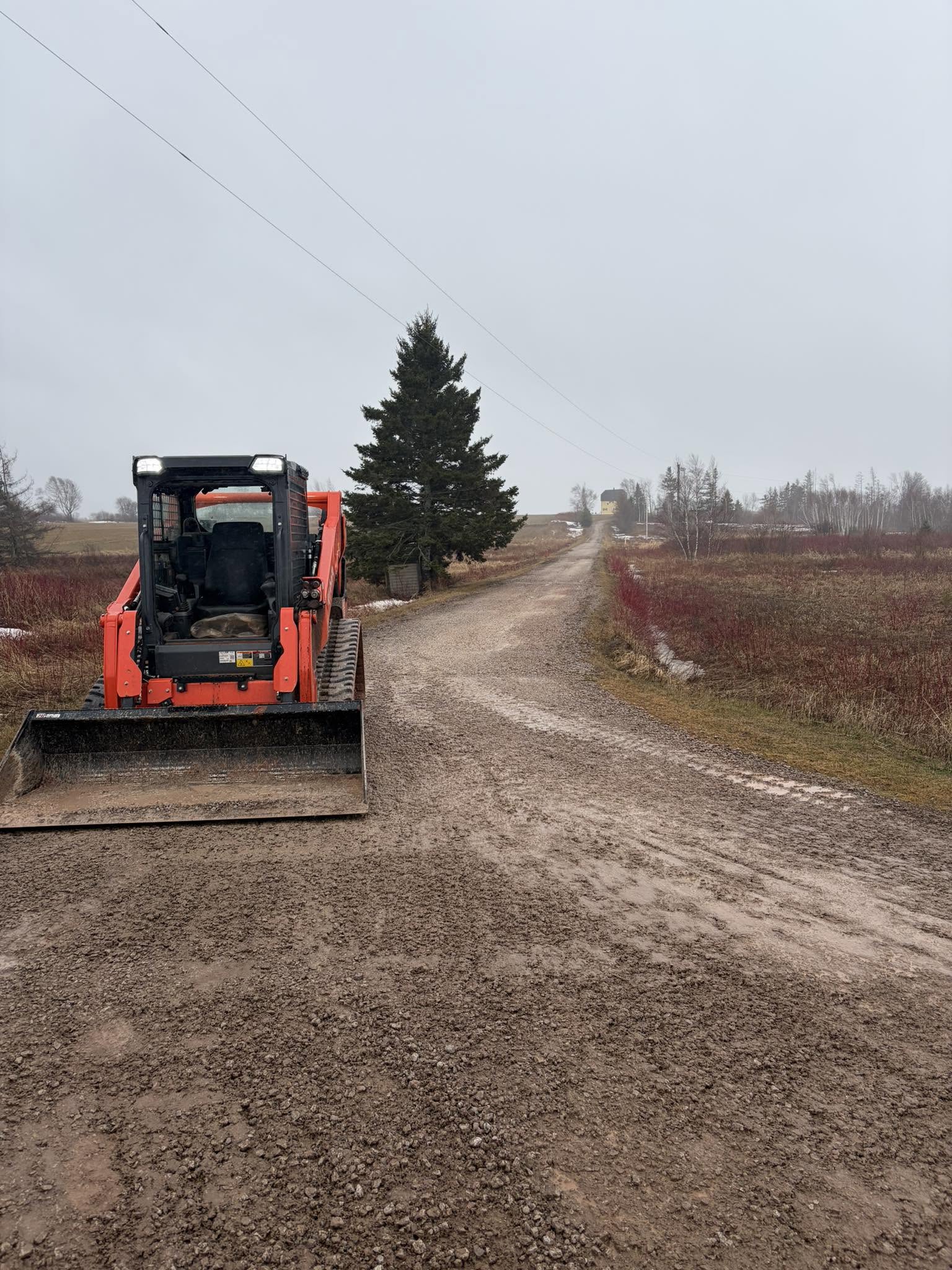 Gravel driveway by Cutting Edge Landscaping & Excavation