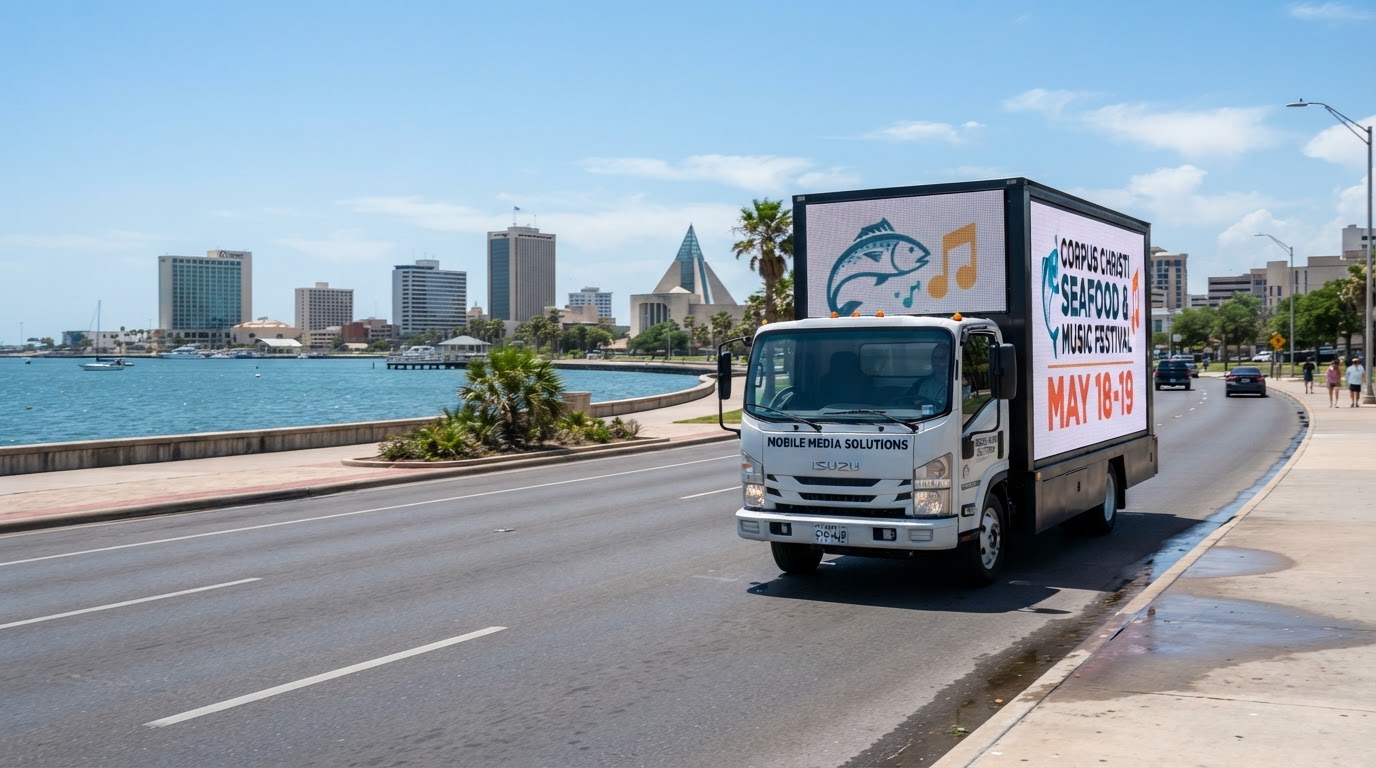 Motivo mobile billboard truck driving through Corpus Christi, Texas near the waterfront during the day