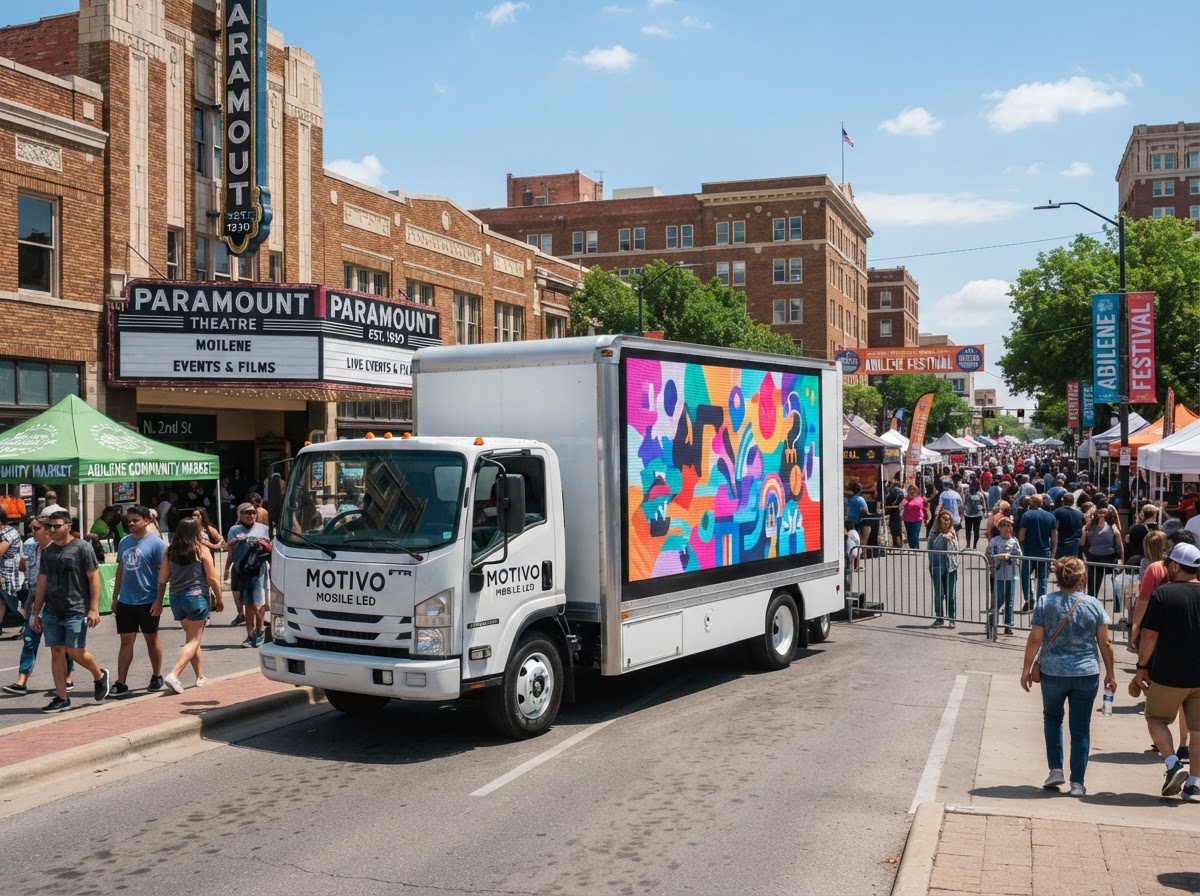 Motivo mobile LED billboard truck near an Abilene community event venue and downtown festival area