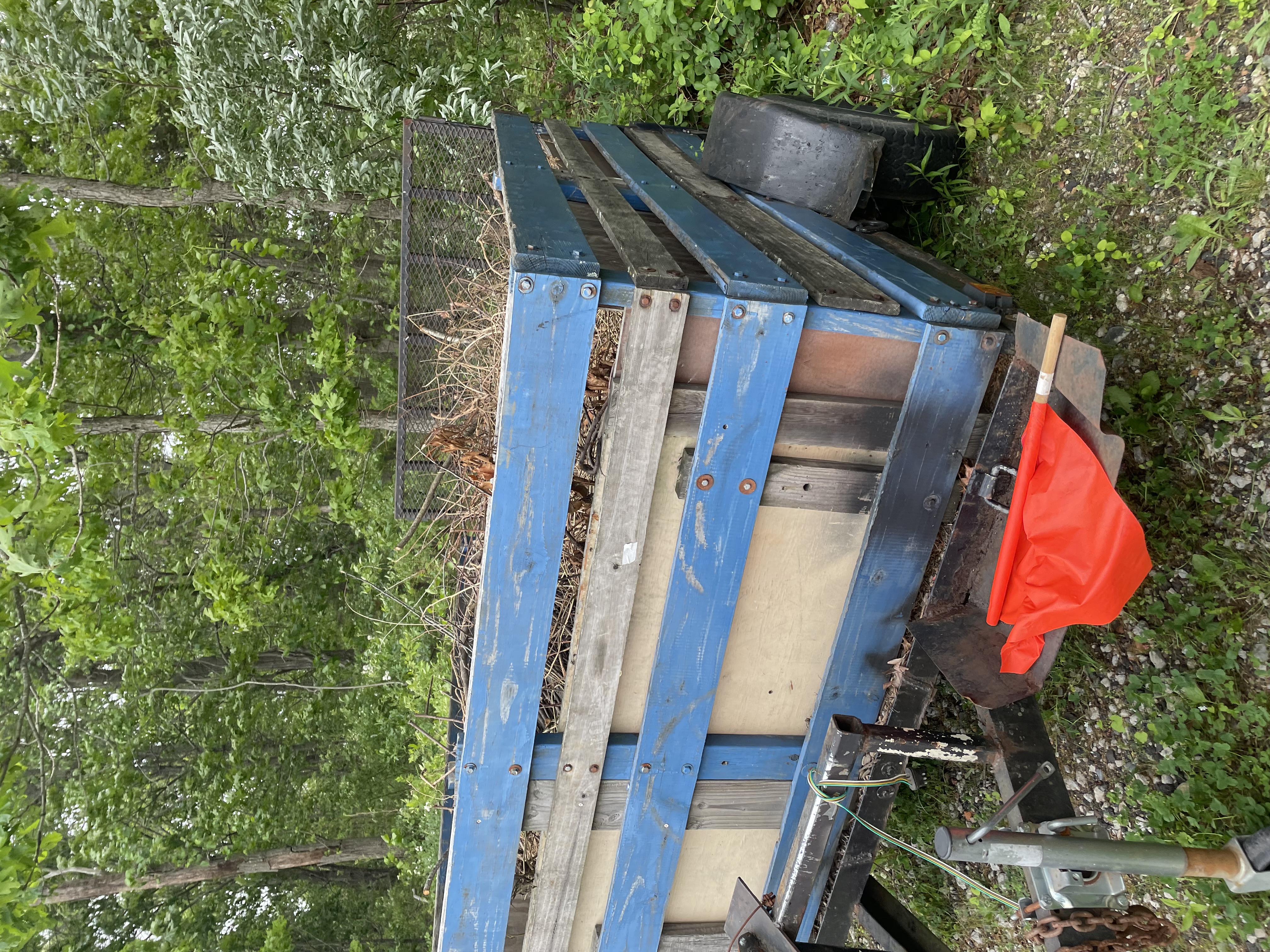 Trailer loaded with yard waste and branches in Patchogue NY