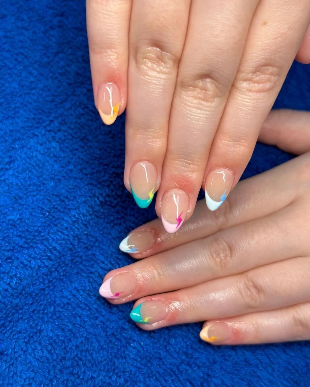 Colorful French tip nail art at Lotus Nail Salon