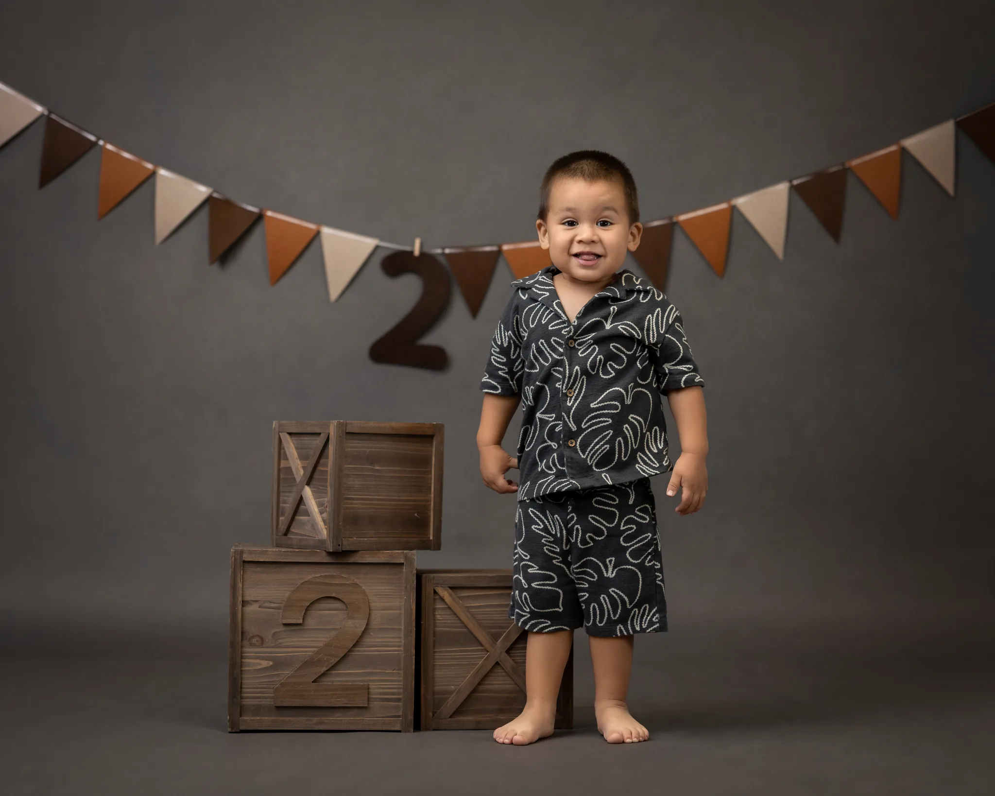 Tropical-themed 2nd birthday session with monstera leaf outfit