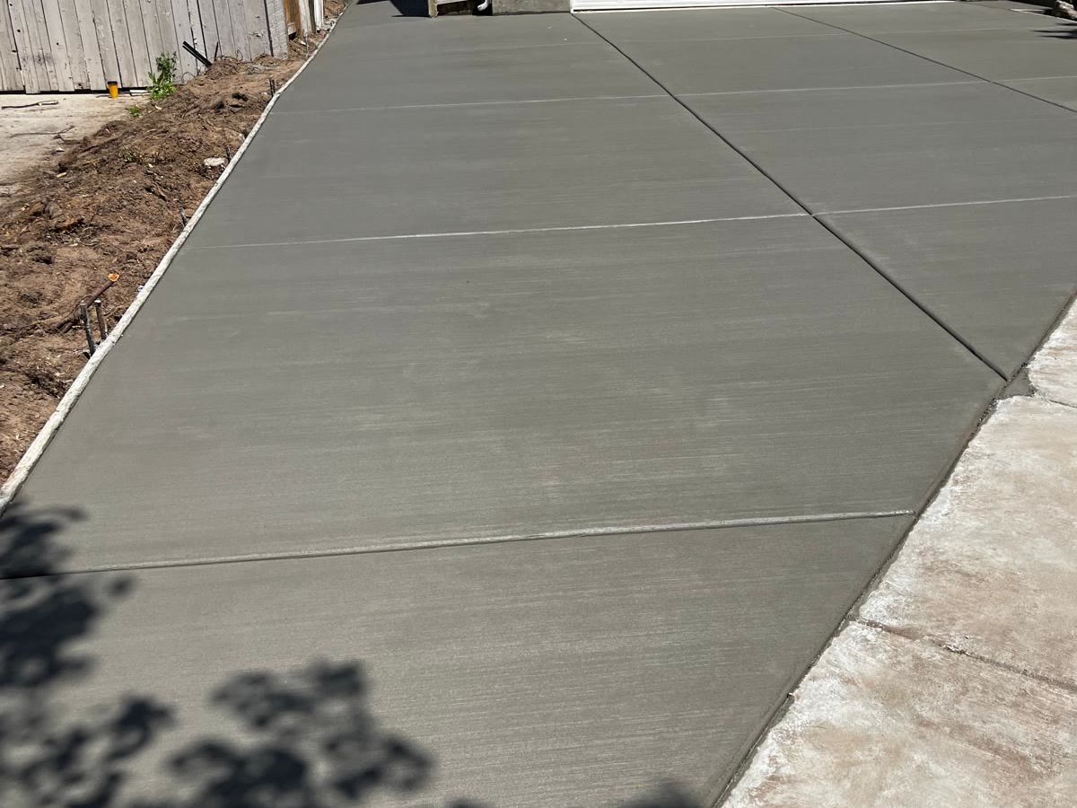 Repaired and resurfaced concrete driveway