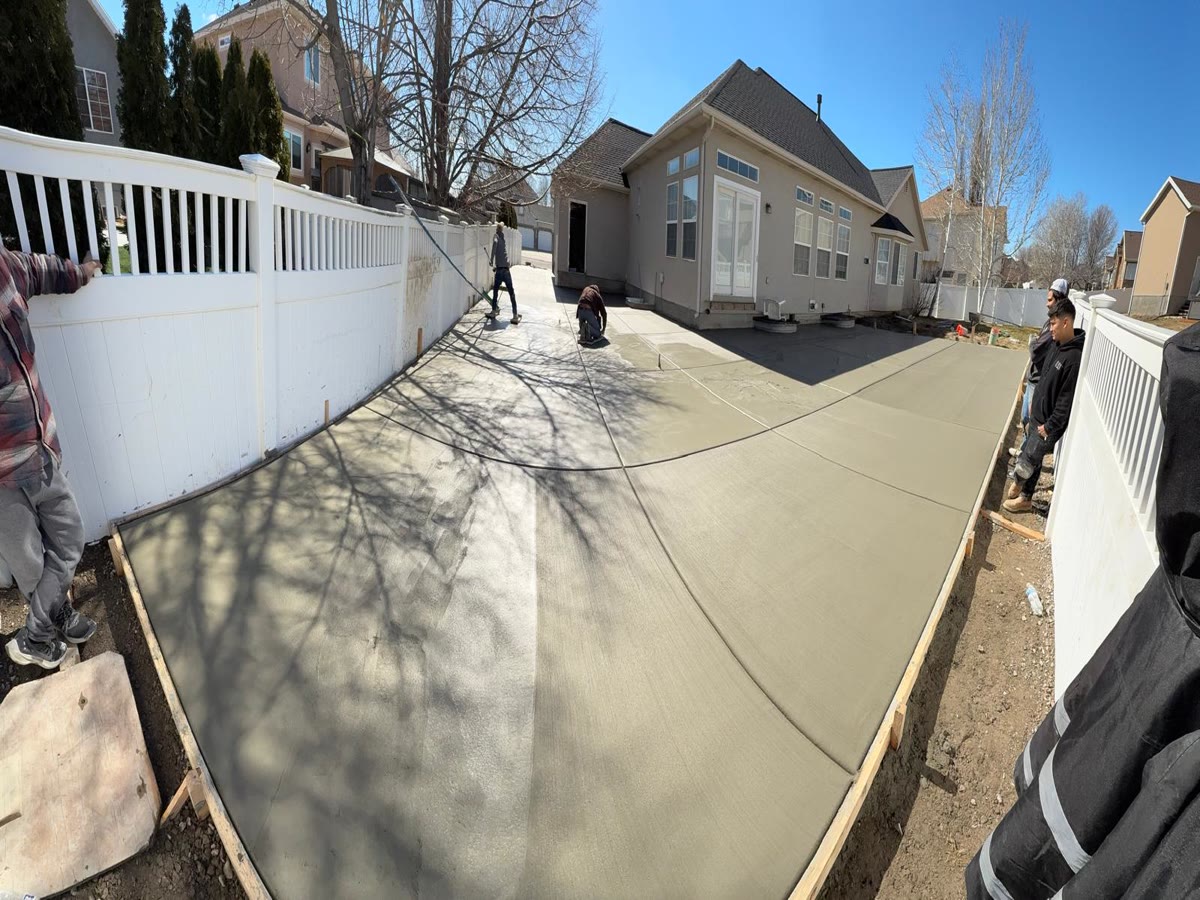 Great Rock Construction and Concrete crew finishing a driveway in Herriman, Utah