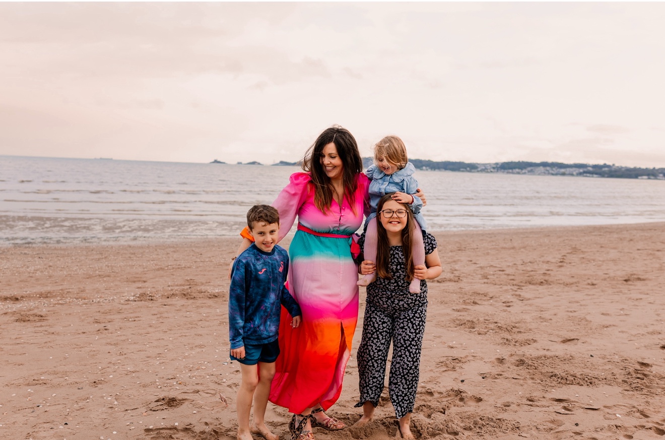 Beth with family on the beach