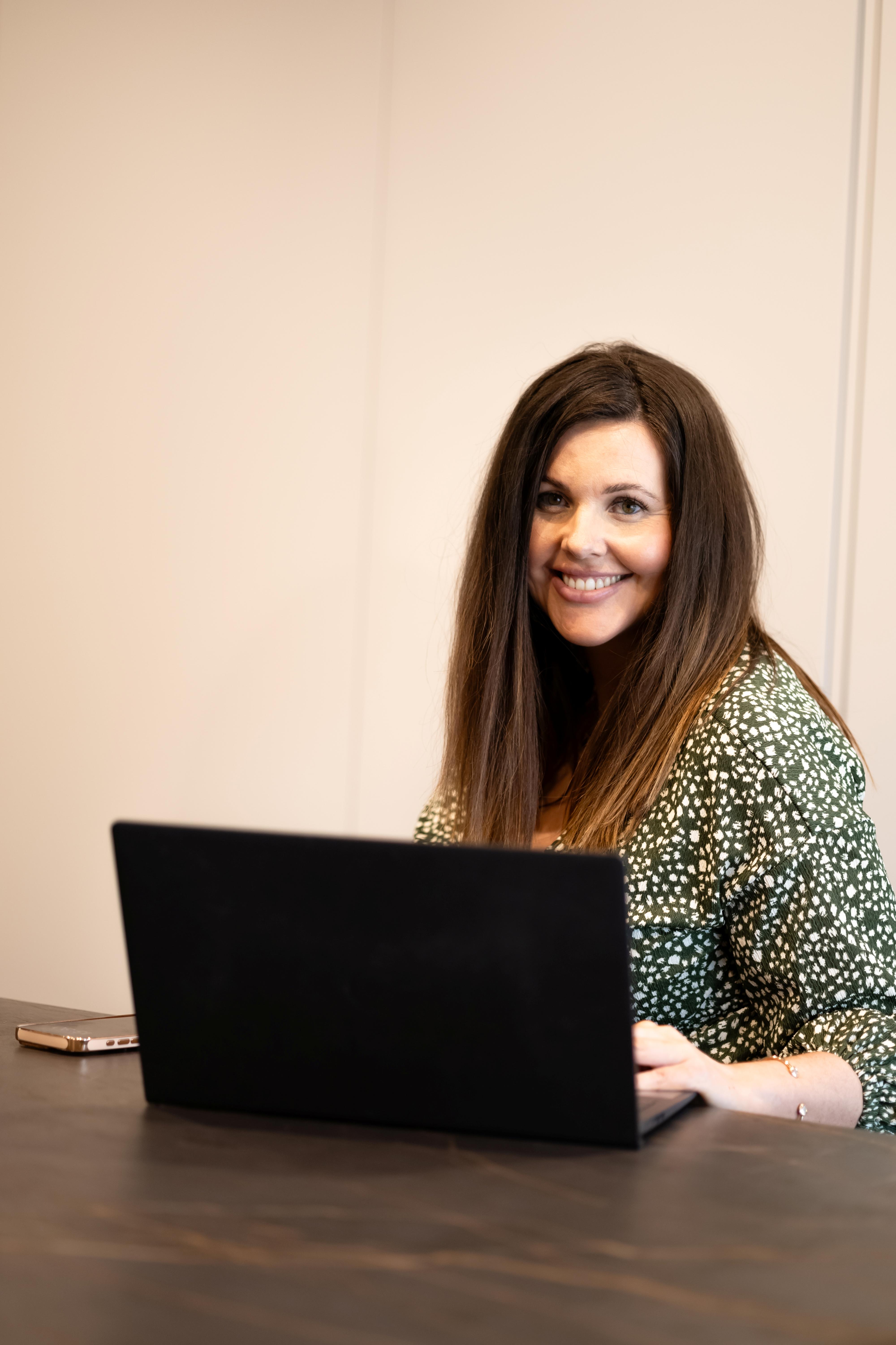 Mortgage process explained step by step - Beth Thomas at laptop providing guidance