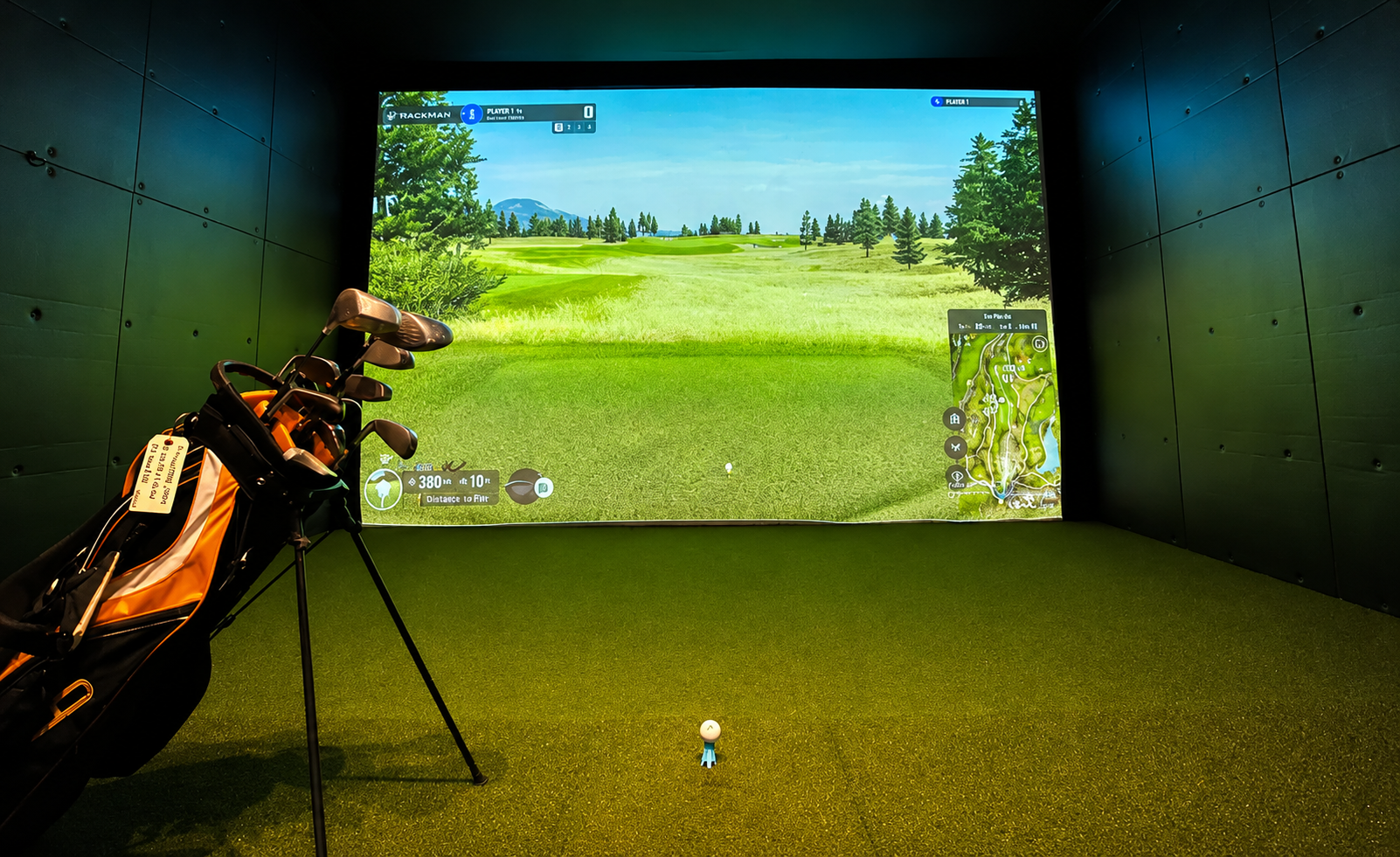 People enjoying indoor golf simulator