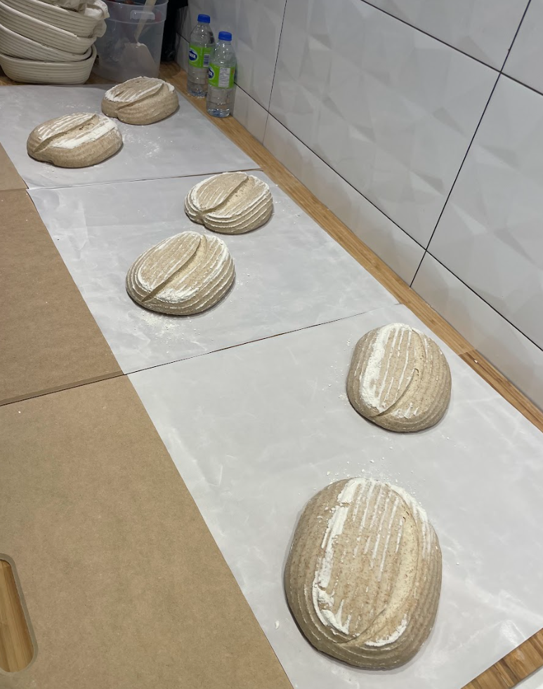 Proofing and scoring fresh sourdough bread before baking