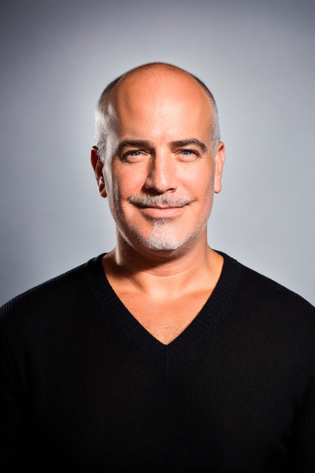 Randy Goldberg studio portrait in black sweater, tokenization executive
