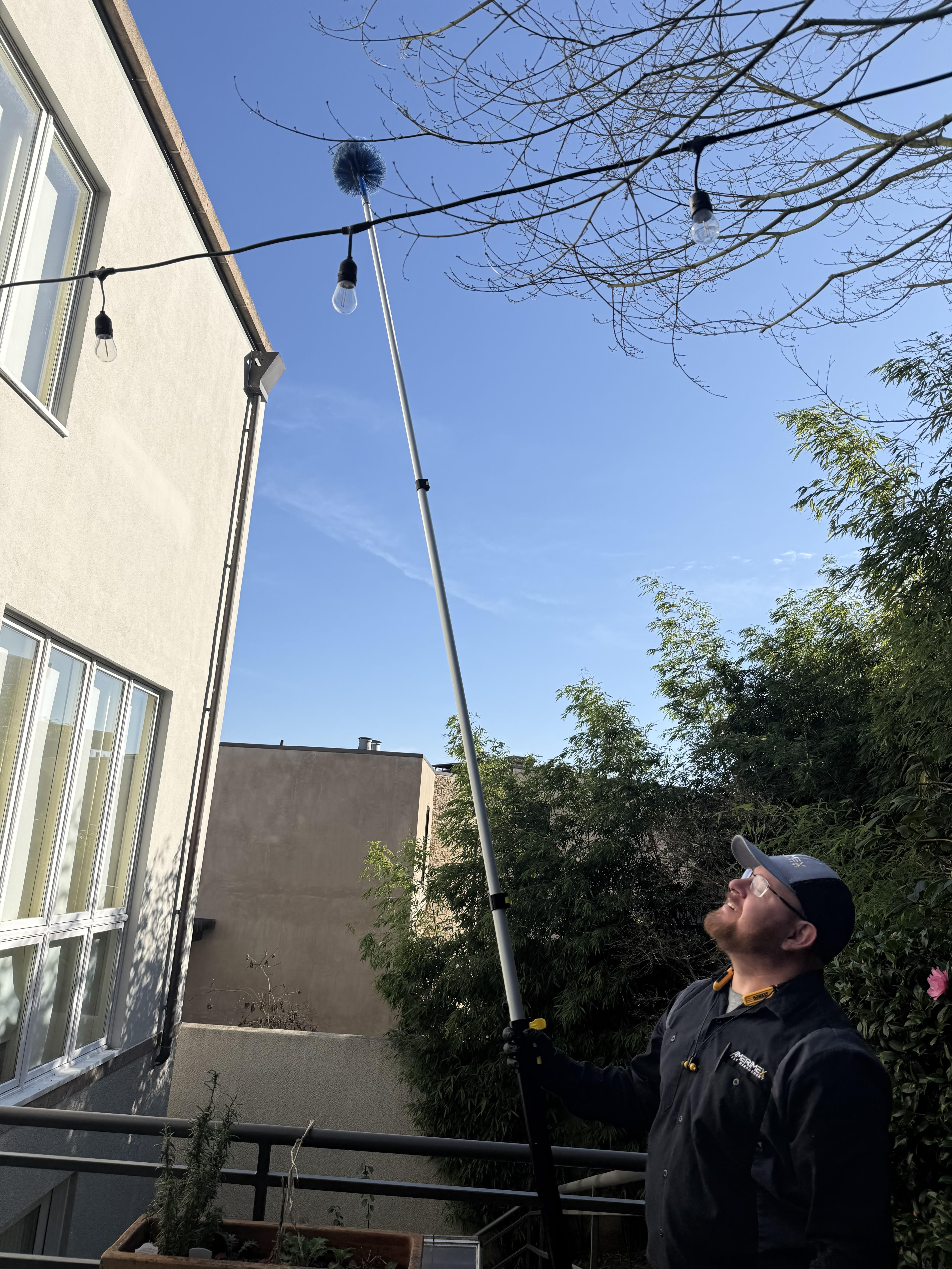 Technician treating eaves