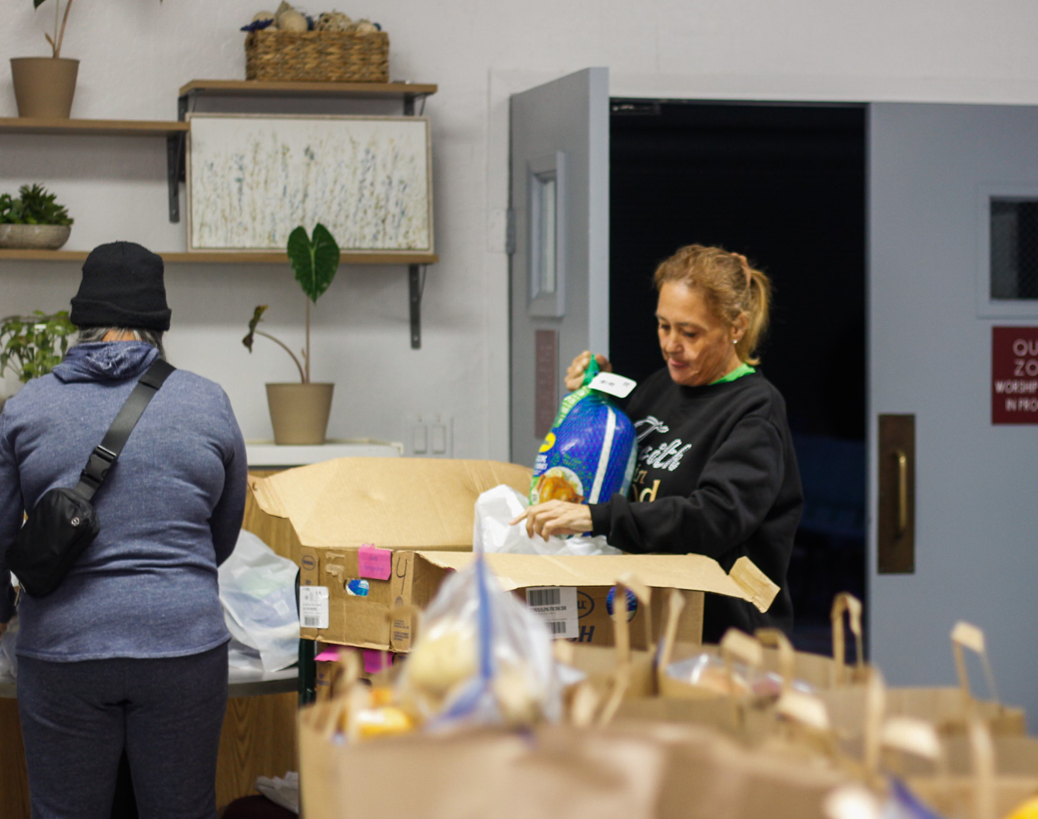 Volunteers sorting and packing food