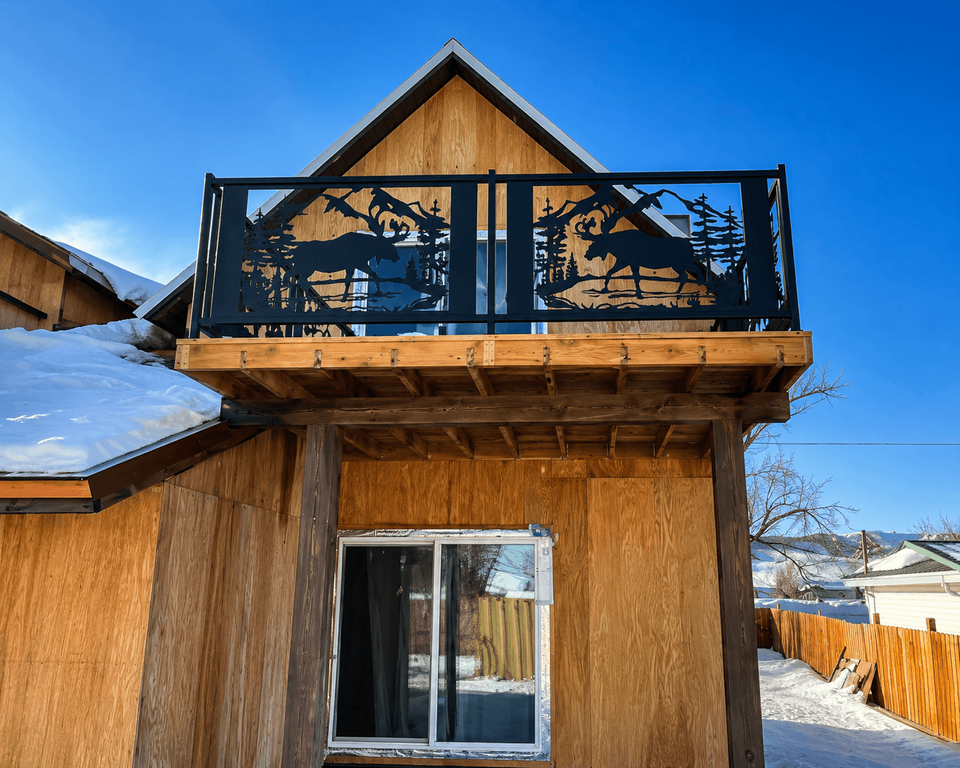 Custom iron handrails for a luxury mountain cabin deck