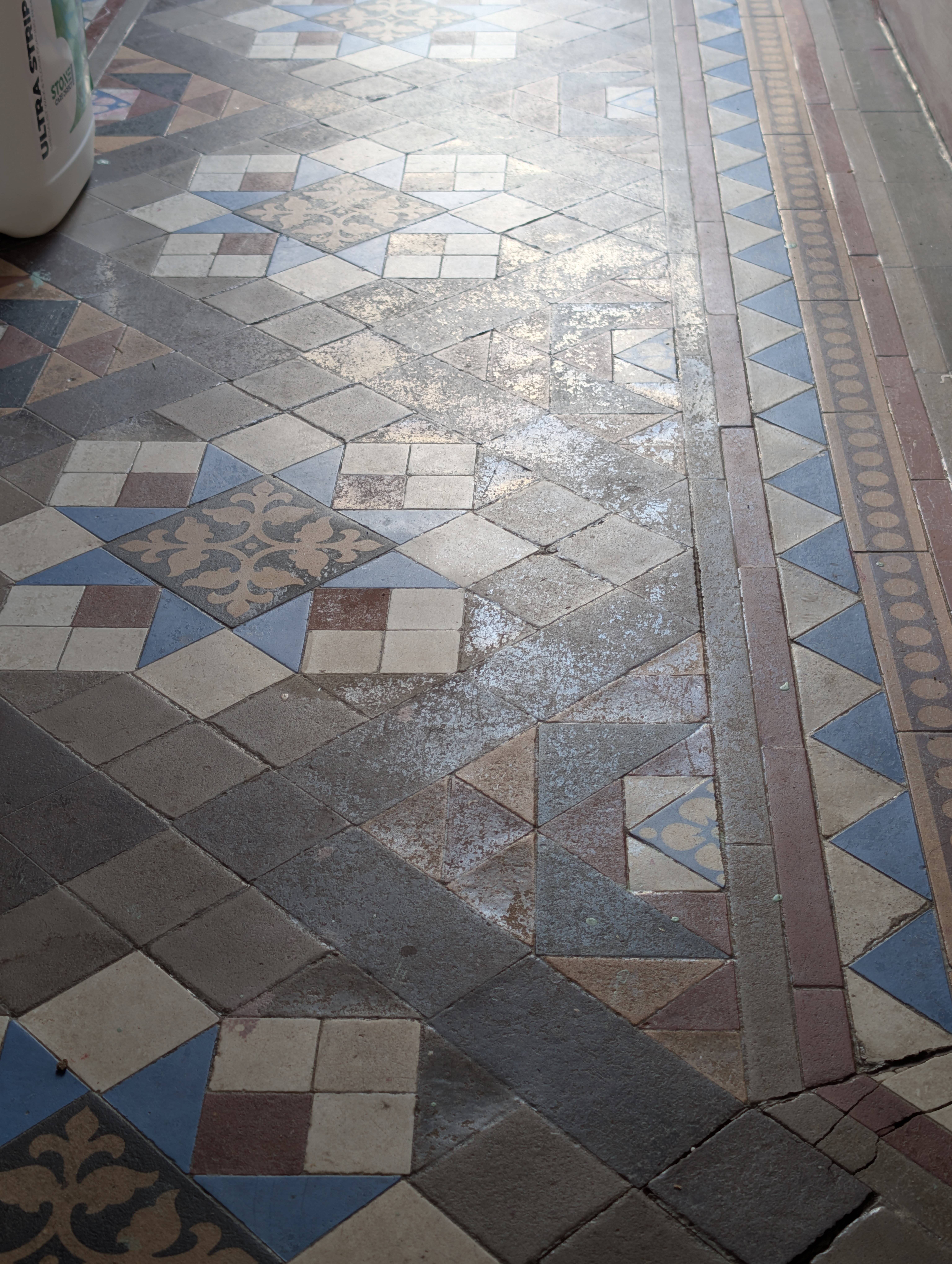 Victorian tiled floor before restoration - dirty and dull
