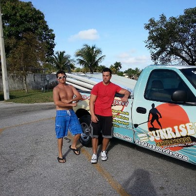 Founders of Sunrise Paddleboards with their delivery truck