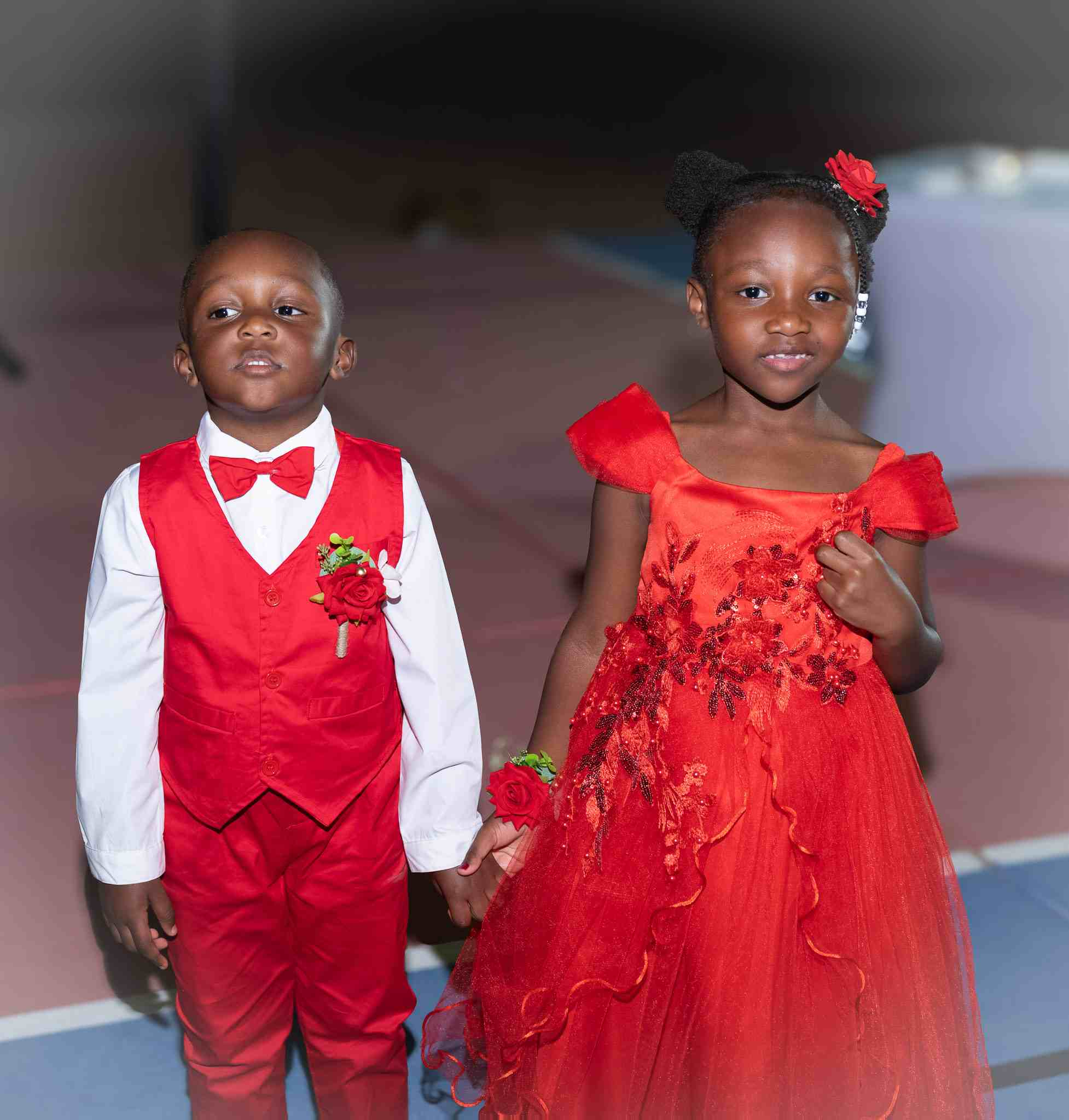 Young Guests in Vibrant Red Attire