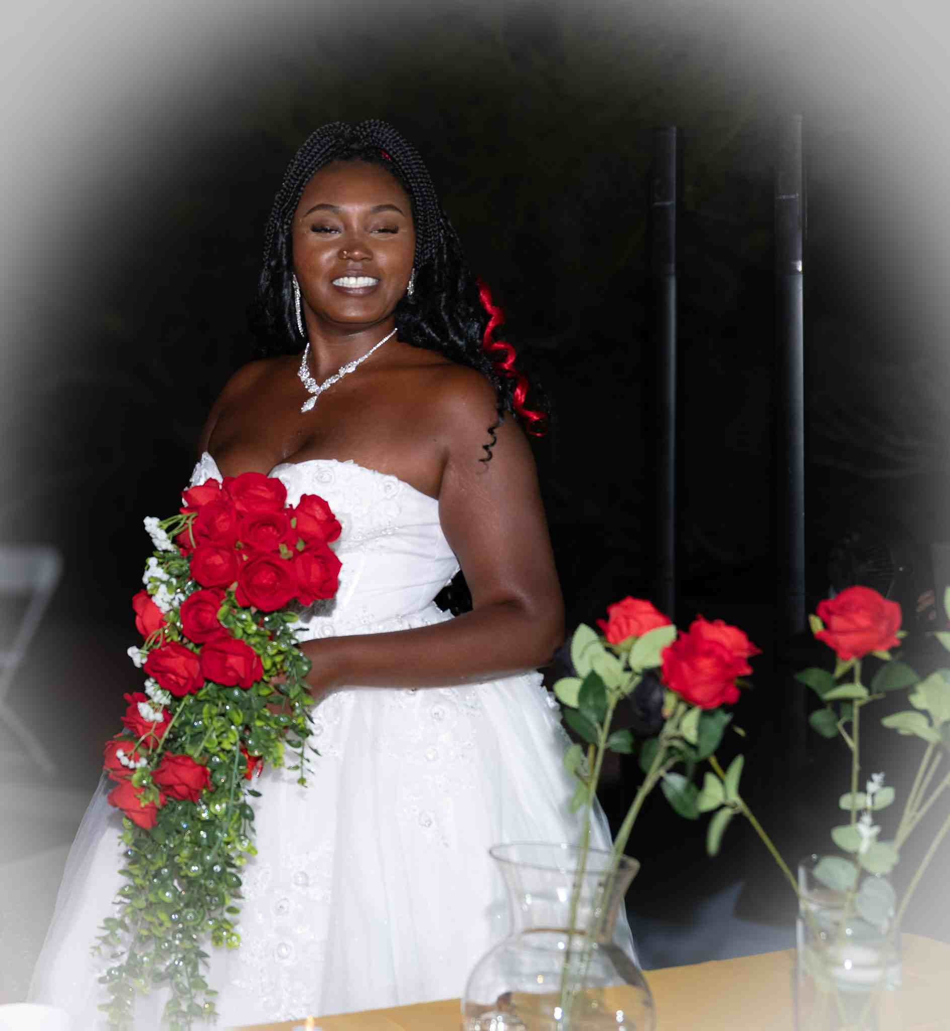 Radiant Bride with Crimson Rose Cascade