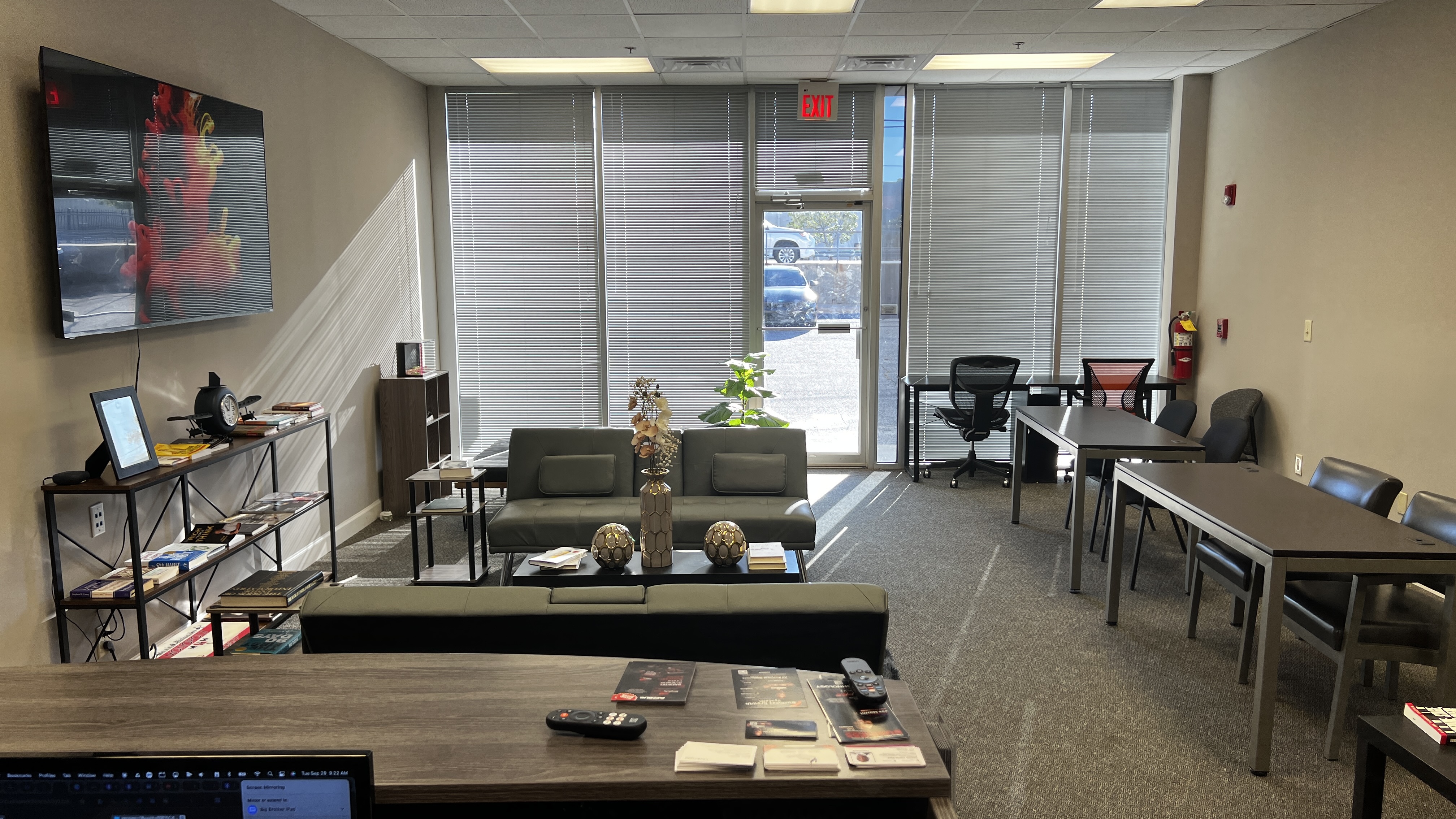 Resource library shelf, training tables, and collaboration area inside Simplicity Genius Business Resource Center