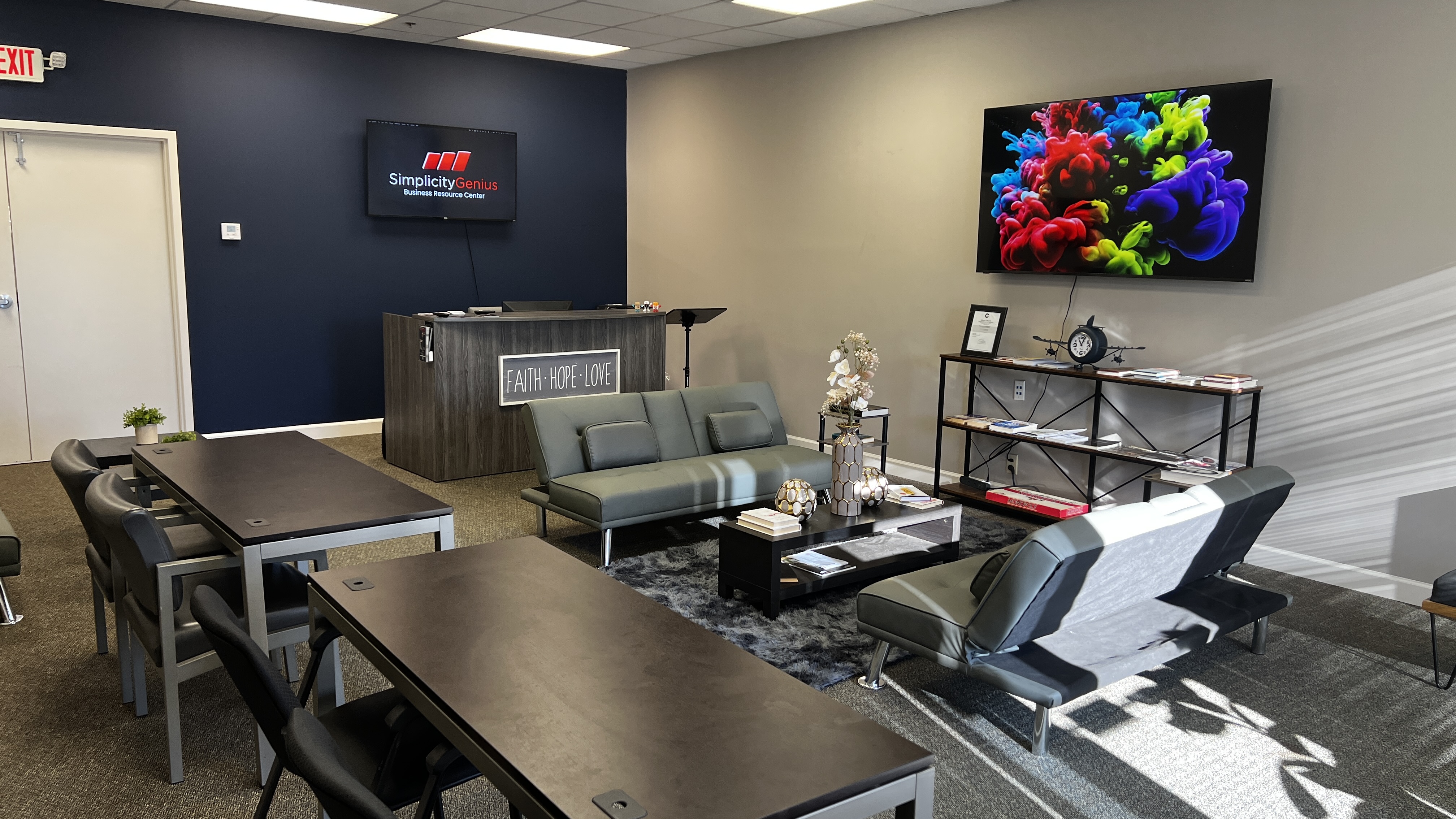 Meeting and training tables configured with digital presentation display at Simplicity Genius Business Resource Center