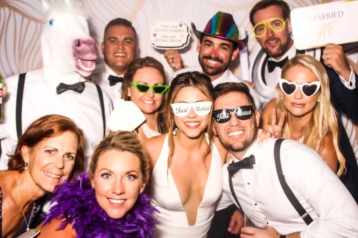 Group of friends laughing and having fun at a Photo-N-Go celebration event
