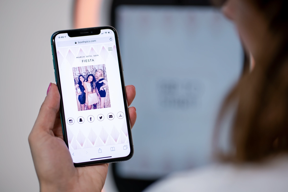 Photo-N-Go Social Digital Kiosk with smartphone sharing at a celebration