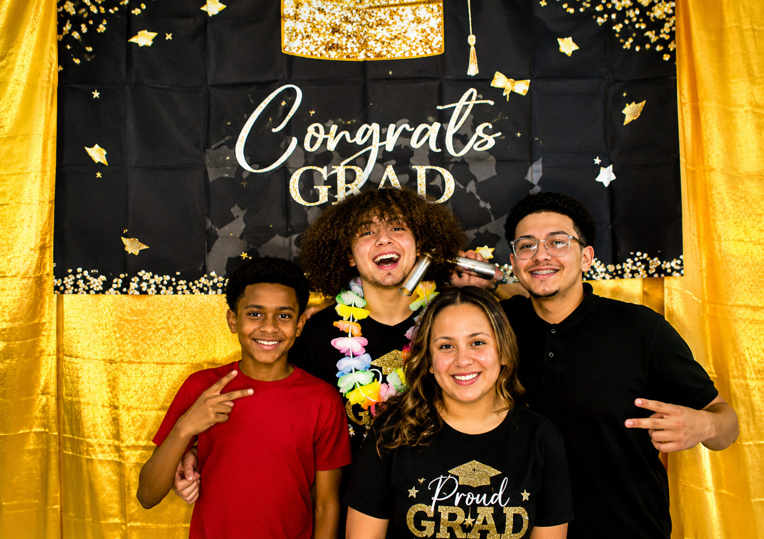 Group of four smiling together at Ricky's Graduation Party