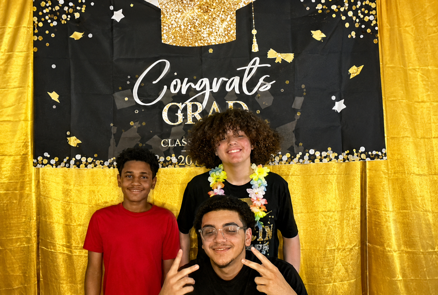 Three friends posing at Ricky's Graduation Party