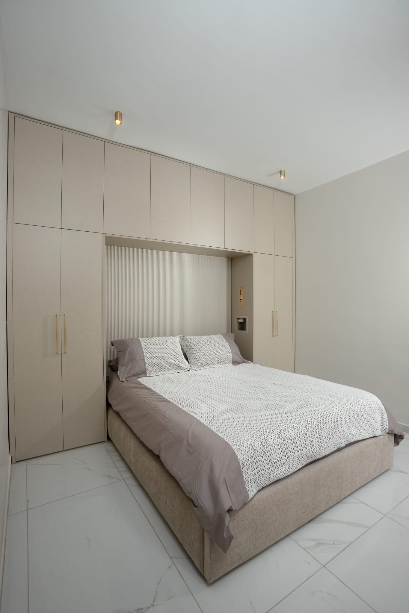 Bedroom with built in headboard