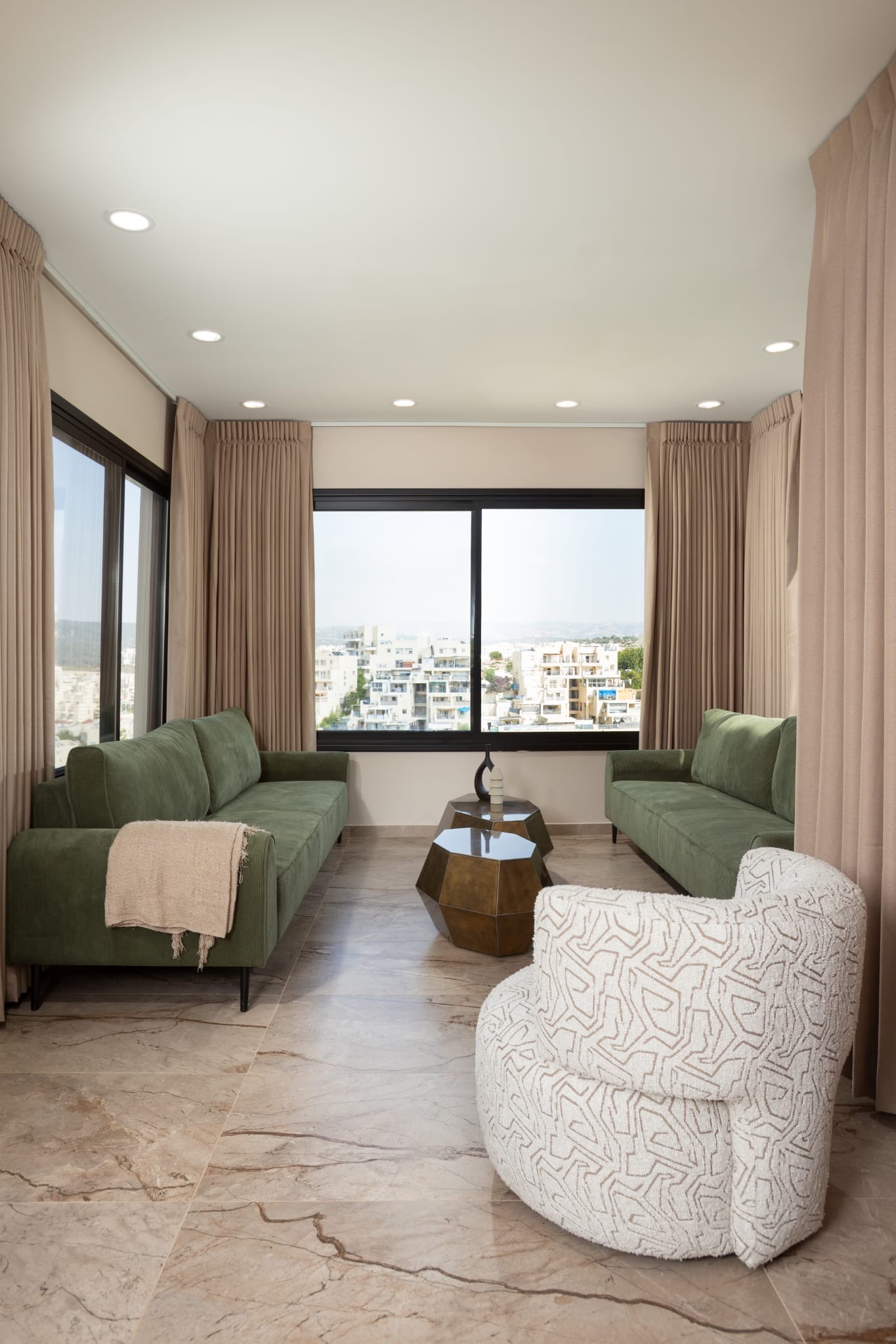Living room with green sofas