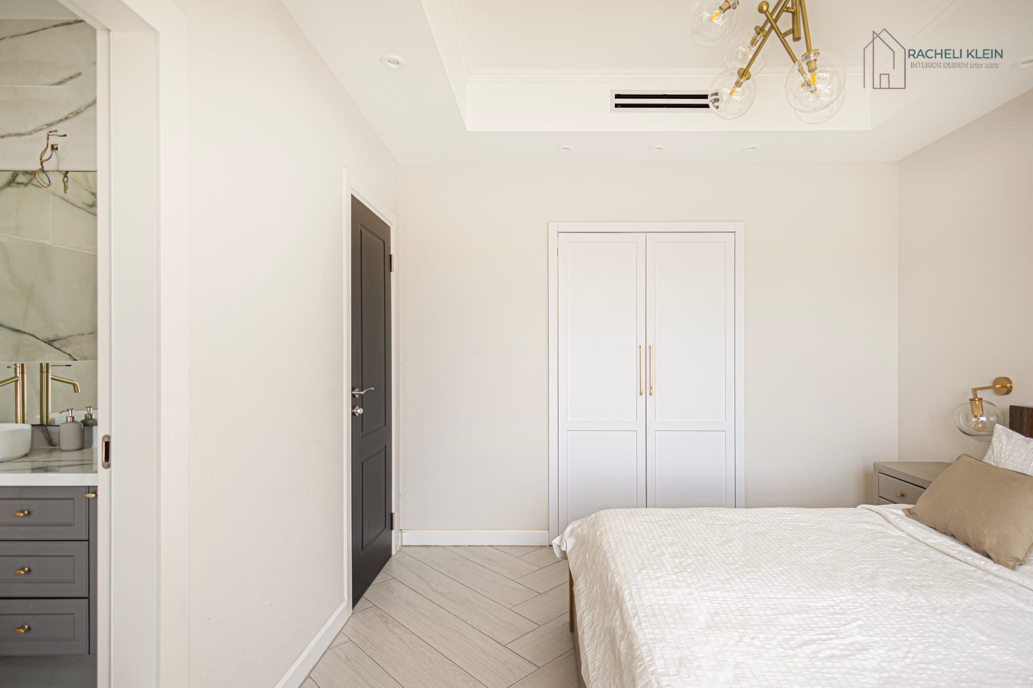 Minimalist bedroom with built-in wardrobe and en-suite