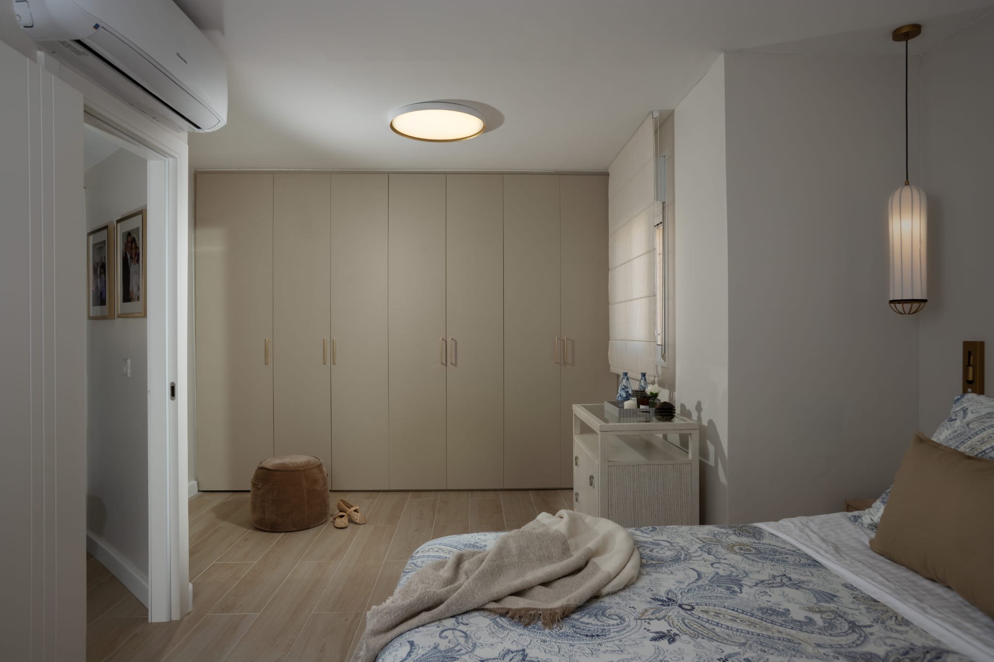 Bedroom with large wardrobe and bed