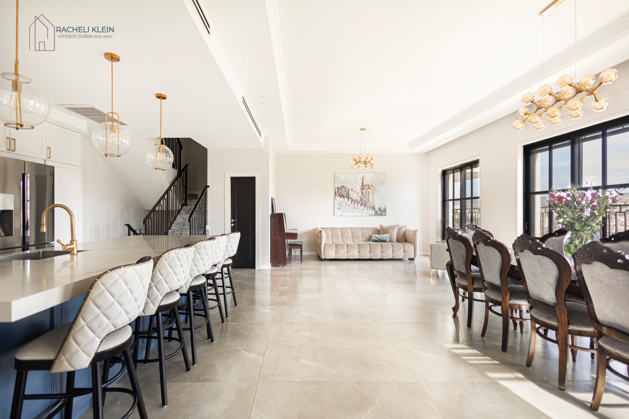 Spacious open plan kitchen and dining with blue island