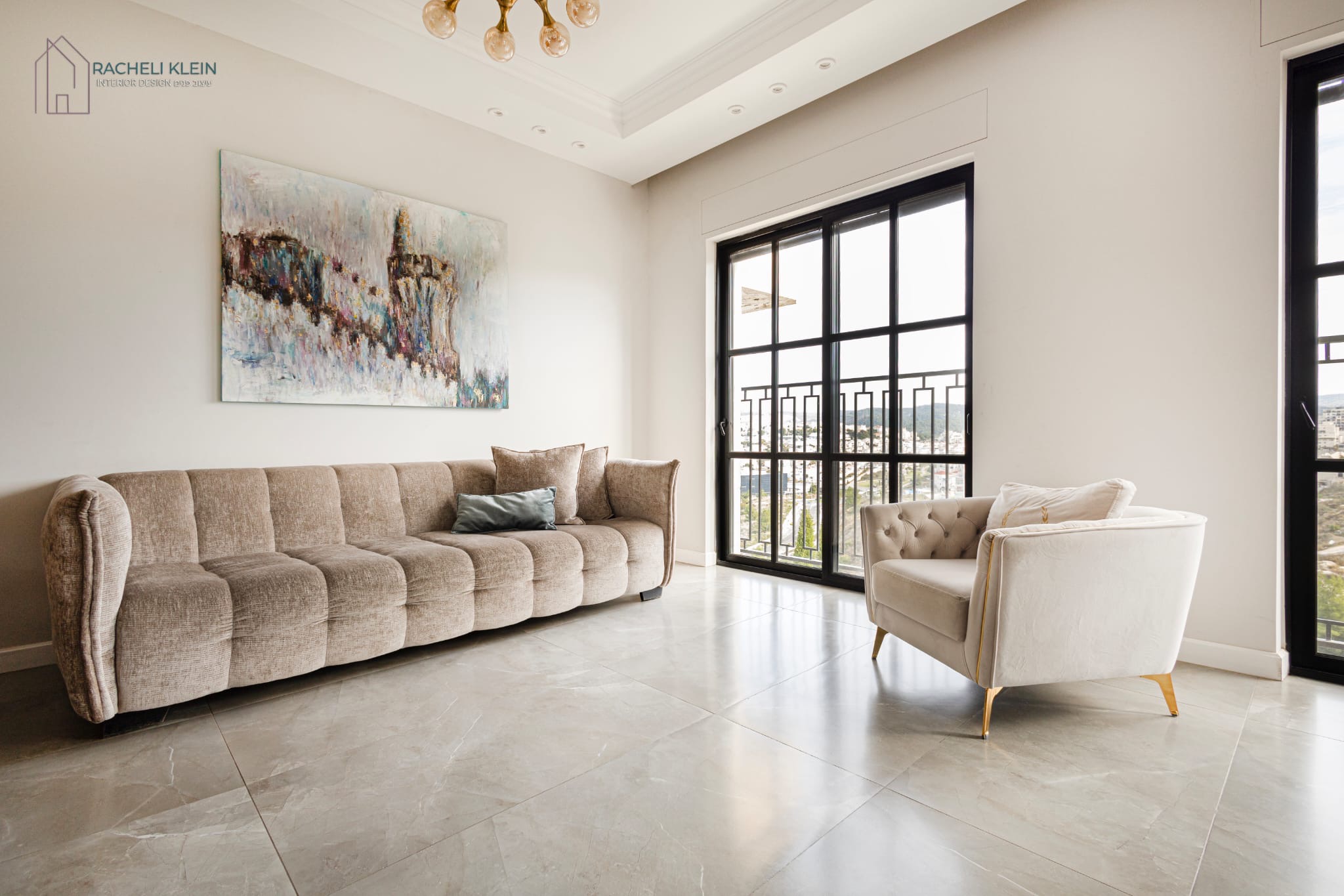 Living room with beige sofa and large painting