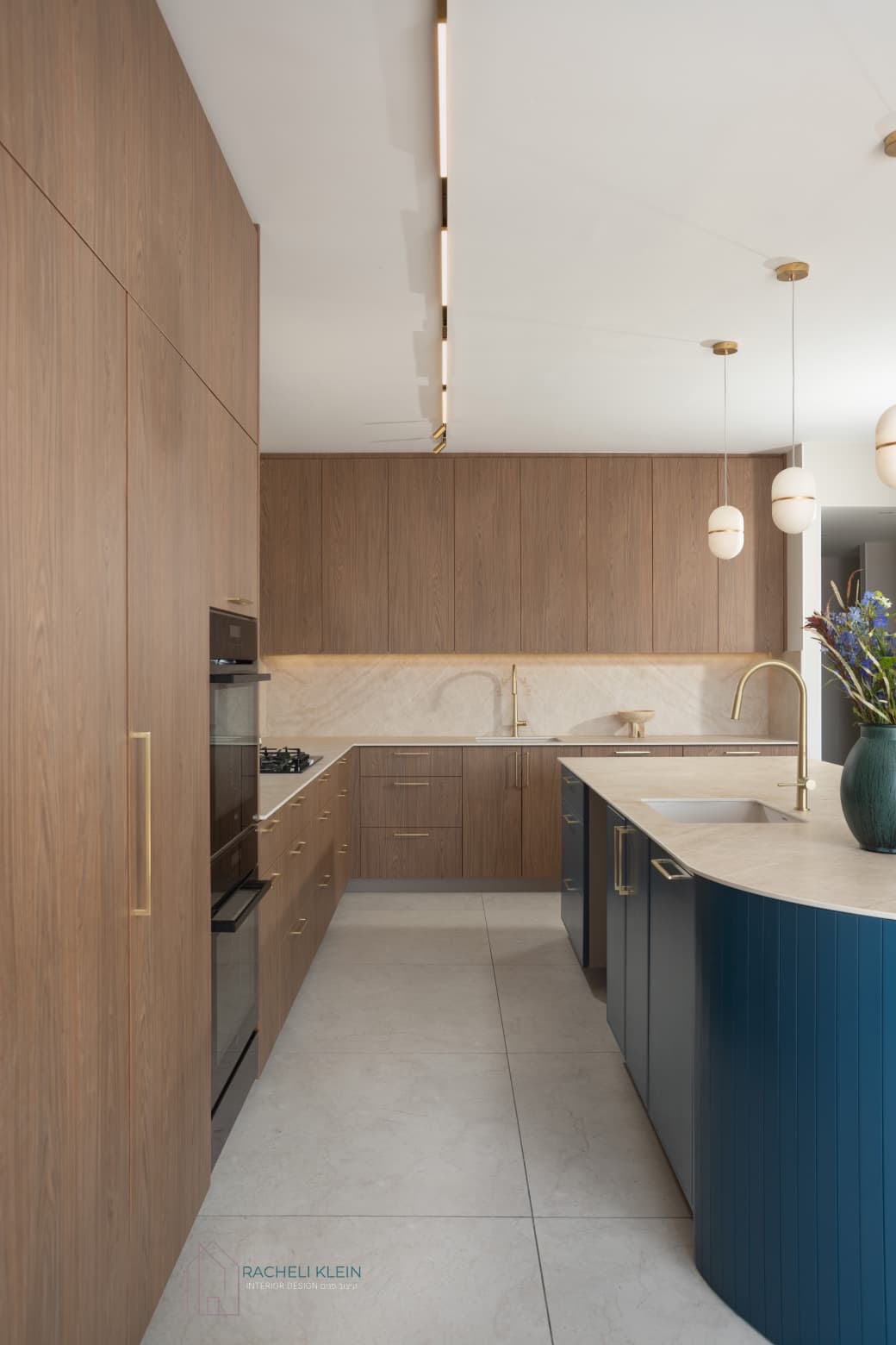 Kitchen with wooden cabinetry and blue island