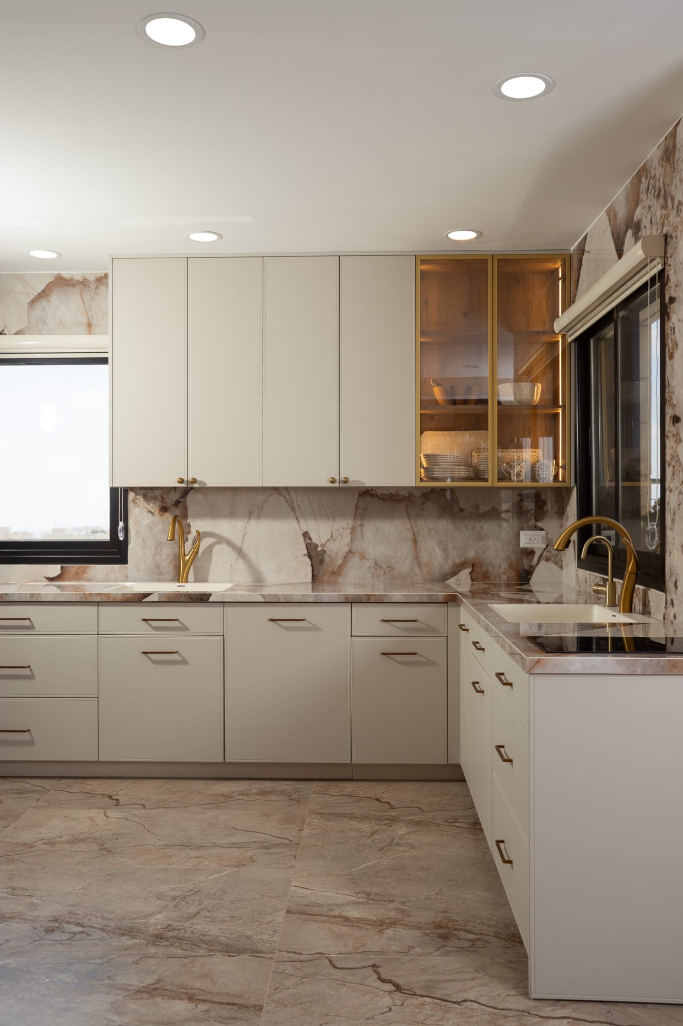 Kitchen with white cabinets and marble backsplash