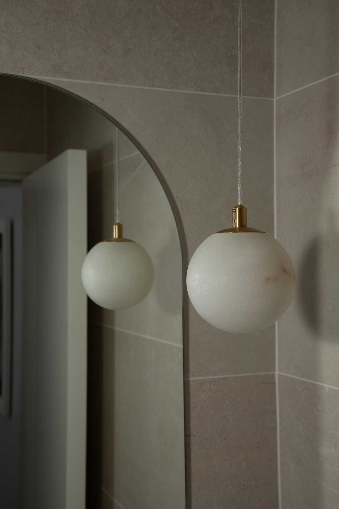 Pendant light in front of mirror