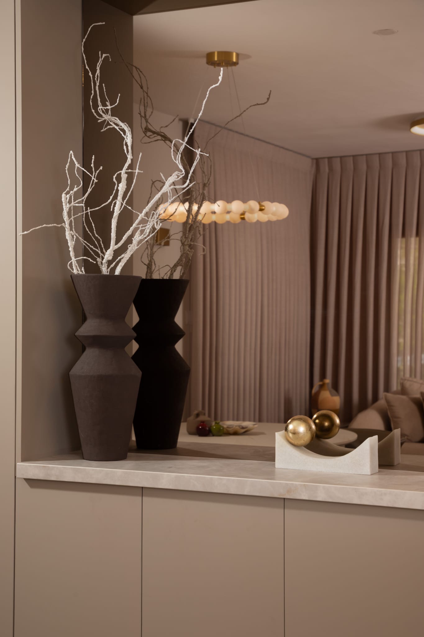 Decorative vases and branches in living space