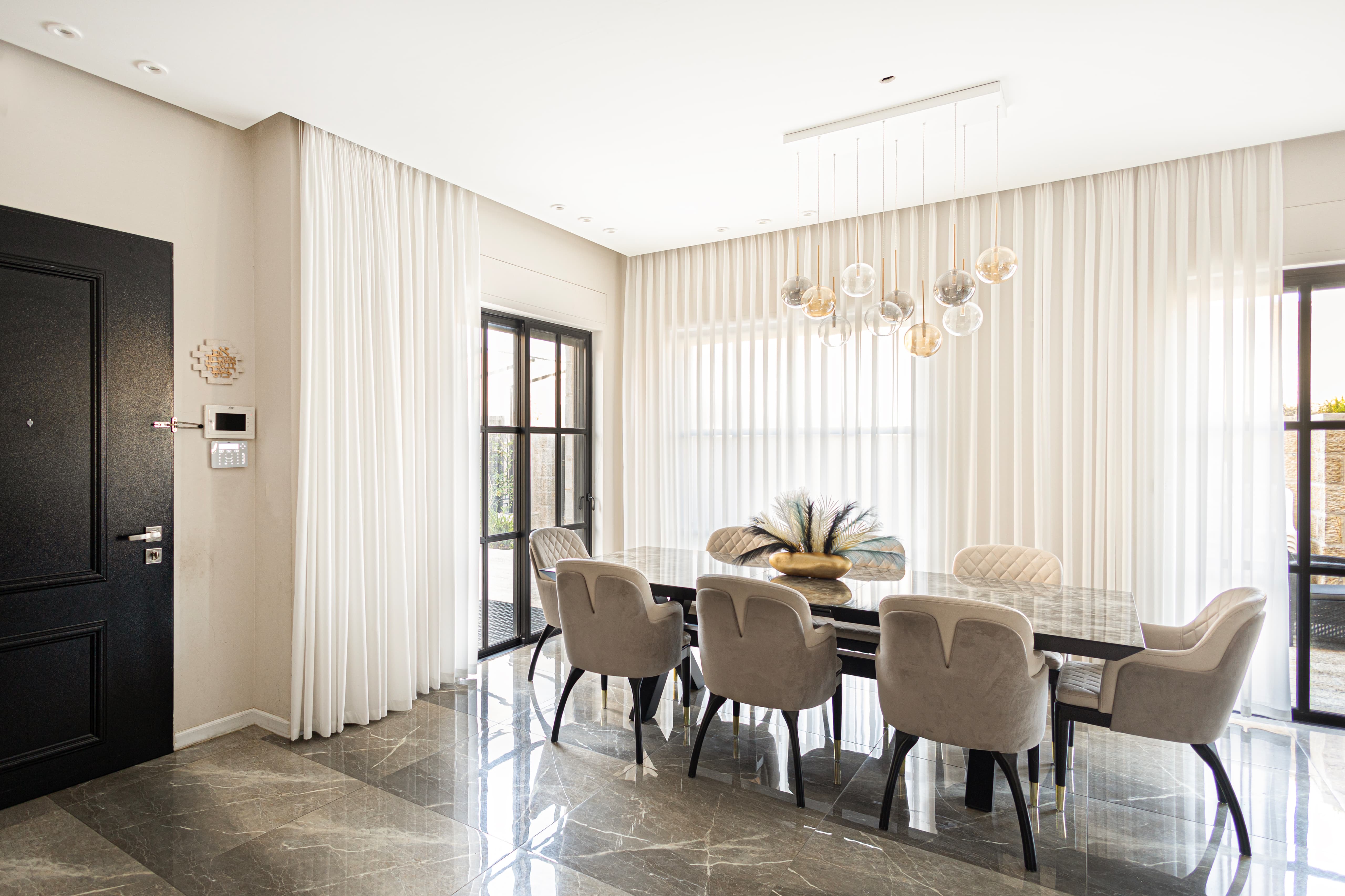 Dining room with large table and chandelier
