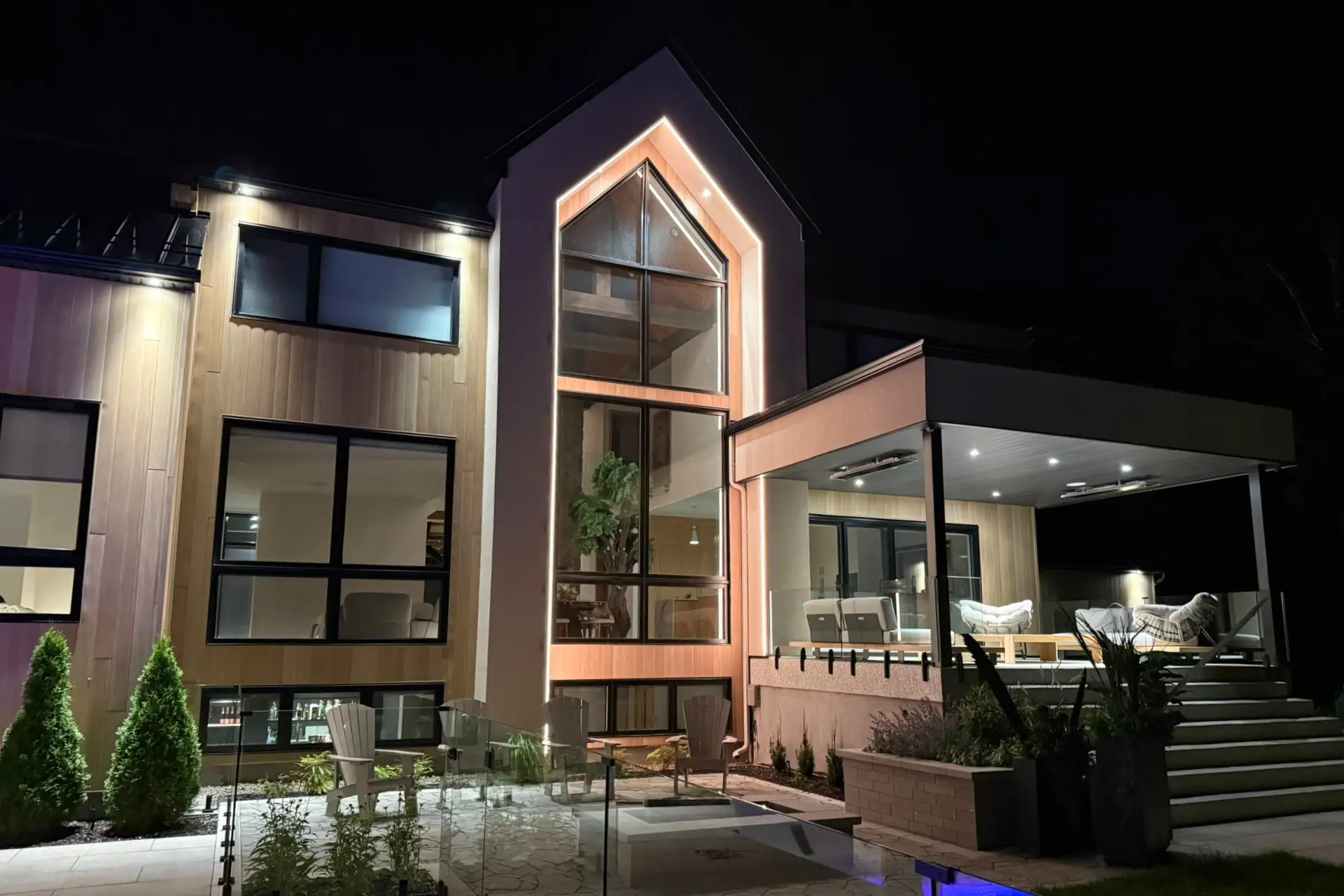Modern luxury home with high-definition track lighting under soffit