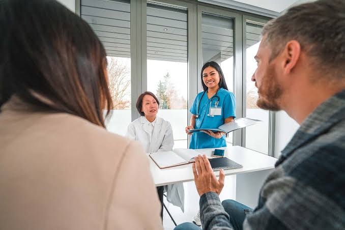 Healthcare consultation and benefits meeting with healthcare professional and employees