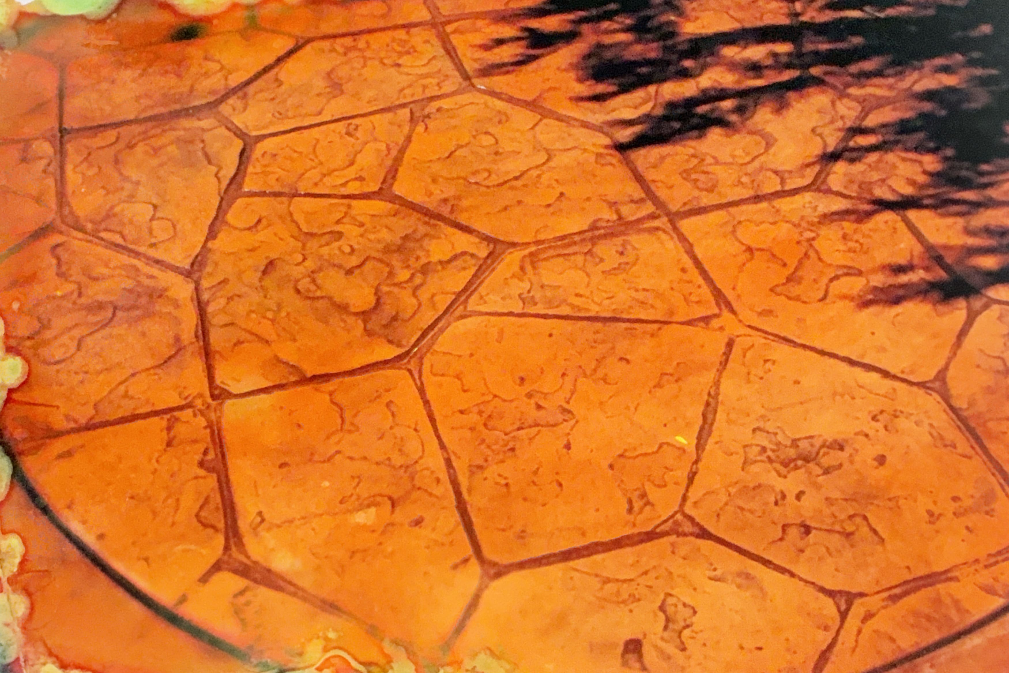Close-up of stamped concrete with terracotta stone pattern
